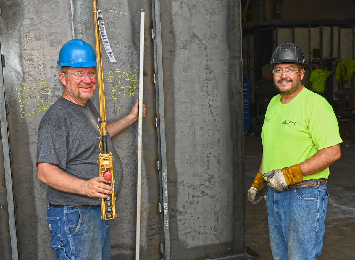 Two TANN employees in shop